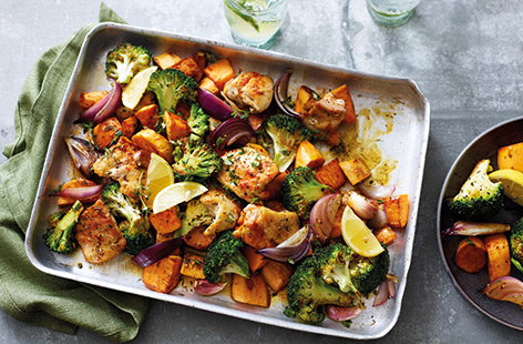 This healthy chicken recipe makes a great family dinner, with chicken thighs, sweet potatoes, red onions and broccoli roasted together in an easy traybake.