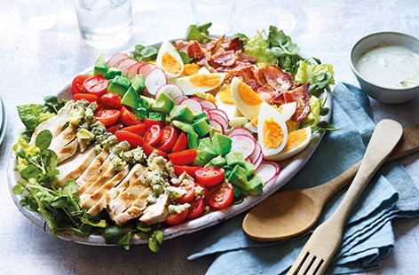 This all-American classic cobb salad recipe lines up crispy bacon, succulent chicken and golden boiled eggs with plenty of colourful veg and a drizzle of creamy blue cheese dressing, for an indulgent salad more than worthy of main course status.