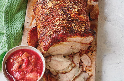 For an Easter lunch with a difference, try this spiced roast pork recipe with tangy orange and rhubarb sauce. 
